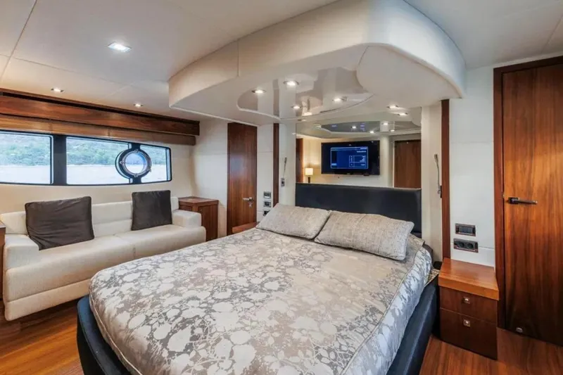 2 Drunk Yacht Photos Pics Luxurious 2012 Sunseeker Manhattan 63 yacht bedroom with elegant decor and modern amenities.