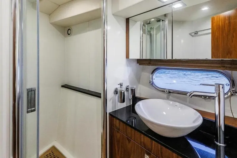 2 Drunk Yacht Photos Pics Luxurious bathroom in 2012 Sunseeker Manhattan 63 yacht with modern fixtures and ocean view.