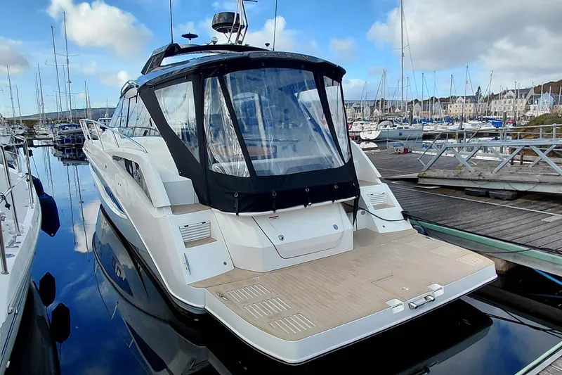 Huge Specifications Yacht Photos Pics 2023 Galeon 405 HTS yacht docked in a marina, showcasing sleek design and modern features.