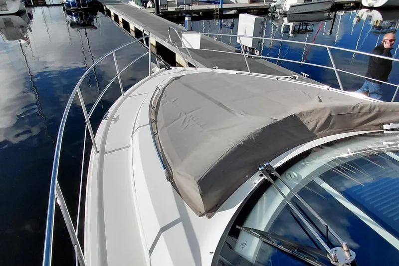 Huge Specifications Yacht Photos Pics 2023 Galeon 405 HTS yacht docked at marina, showcasing sleek design and covered deck.