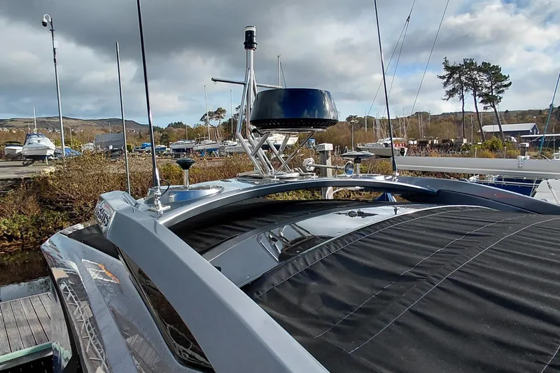 Huge Specifications Yacht Photos Pics 2023 Galeon 405 HTS yacht with sleek design, docked under cloudy skies.