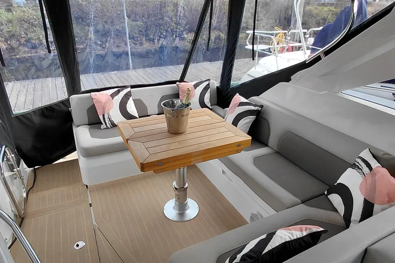 Huge Specifications Yacht Photos Pics Luxurious 2023 Galeon 405 HTS yacht interior with stylish seating and wooden table.