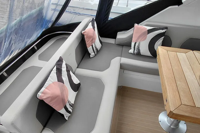 Huge Specifications Yacht Photos Pics 2023 Galeon 405 HTS yacht interior with modern seating and decorative pillows.
