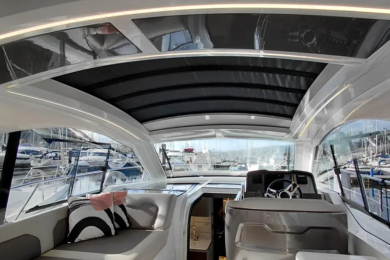 Huge Specifications Yacht Photos Pics Interior of 2023 Galeon 405 HTS yacht with modern seating and helm.
