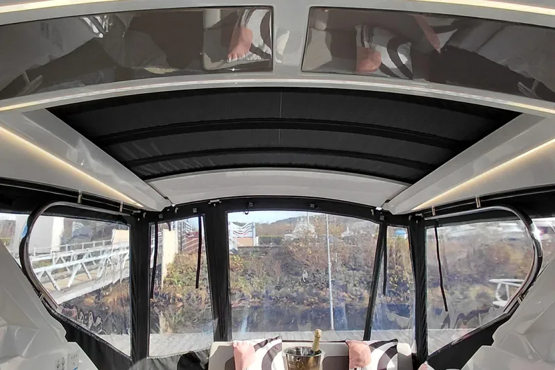 Huge Specifications Yacht Photos Pics Interior view of 2023 Galeon 405 HTS yacht with panoramic windows and luxurious seating.