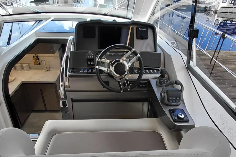 Huge Specifications Yacht Photos Pics 2023 Galeon 405 HTS yacht helm with modern controls and luxurious interior.