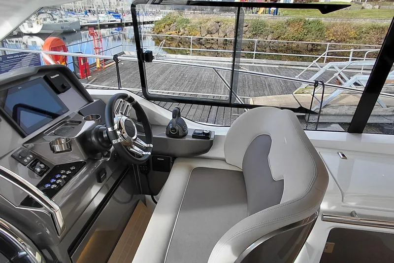 Huge Specifications Yacht Photos Pics 2023 Galeon 405 HTS yacht helm with modern controls and comfortable seating.