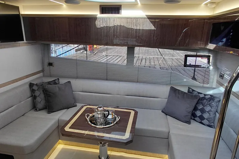 Huge Specifications Yacht Photos Pics Luxurious interior of 2023 Galeon 405 HTS yacht with elegant seating and modern decor.