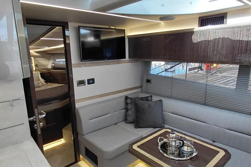 Huge Specifications Yacht Photos Pics Luxurious interior of 2023 Galeon 405 HTS yacht with modern seating and elegant decor.