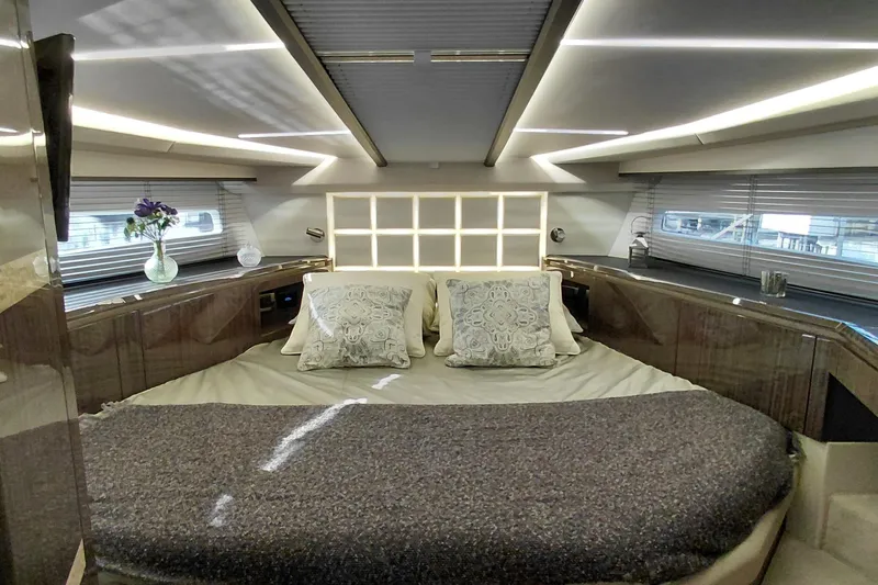 Huge Specifications Yacht Photos Pics Luxurious interior of 2023 Galeon 405 HTS yacht with elegant bedding and modern lighting.