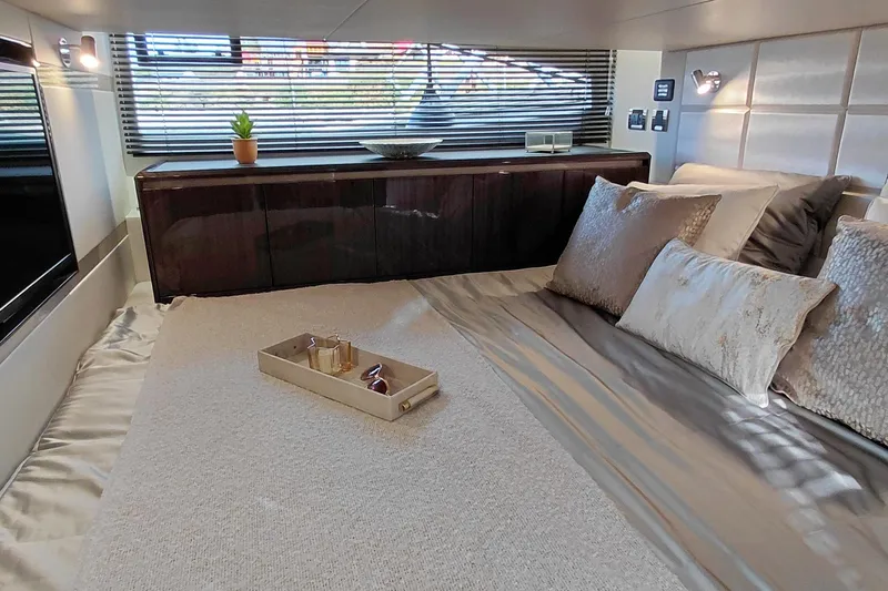 Huge Specifications Yacht Photos Pics Luxurious bedroom interior of 2023 Galeon 405 HTS yacht with elegant bedding and decor.