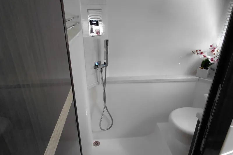 Huge Specifications Yacht Photos Pics Modern bathroom in 2023 Galeon 405 HTS yacht with shower and elegant decor.