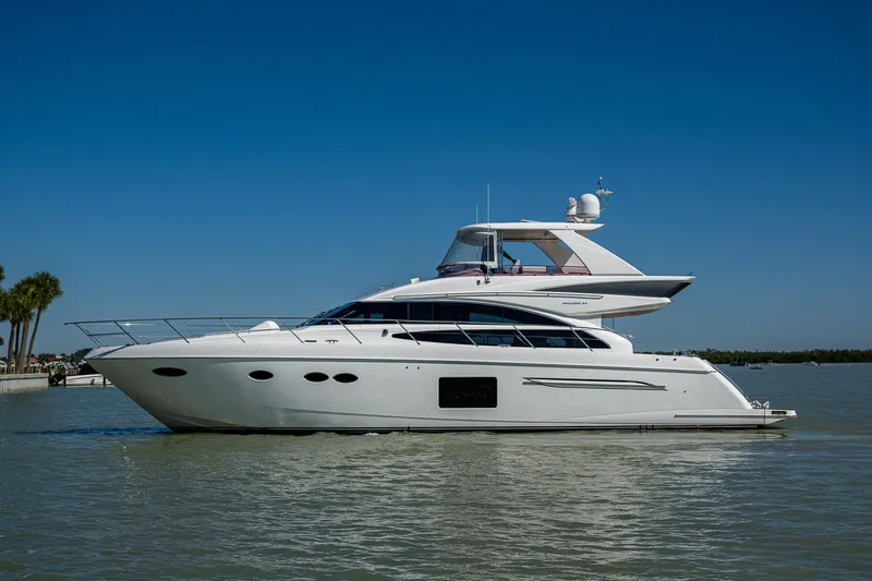 No Vacansea Yacht Photos Pics 2016 Princess Flybridge 64 Motor Yacht cruising on calm waters under clear skies.