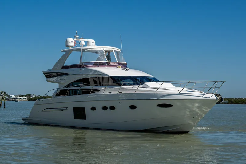 No Vacansea Yacht Photos Pics 2016 Princess Flybridge 64 Motor Yacht cruising on calm waters under clear blue sky.