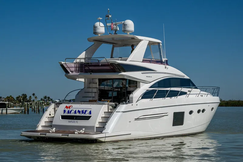 No Vacansea Yacht Photos Pics 2016 Princess Flybridge 64 Motor Yacht on calm water, rear view.