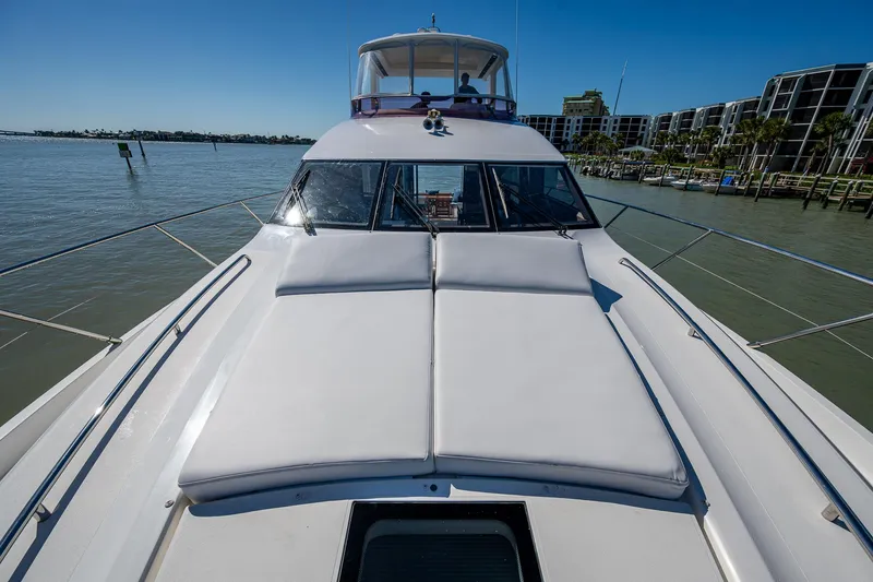 No Vacansea Yacht Photos Pics 2016 Princess Flybridge 64 Motor Yacht on calm water, featuring spacious deck and sleek design.