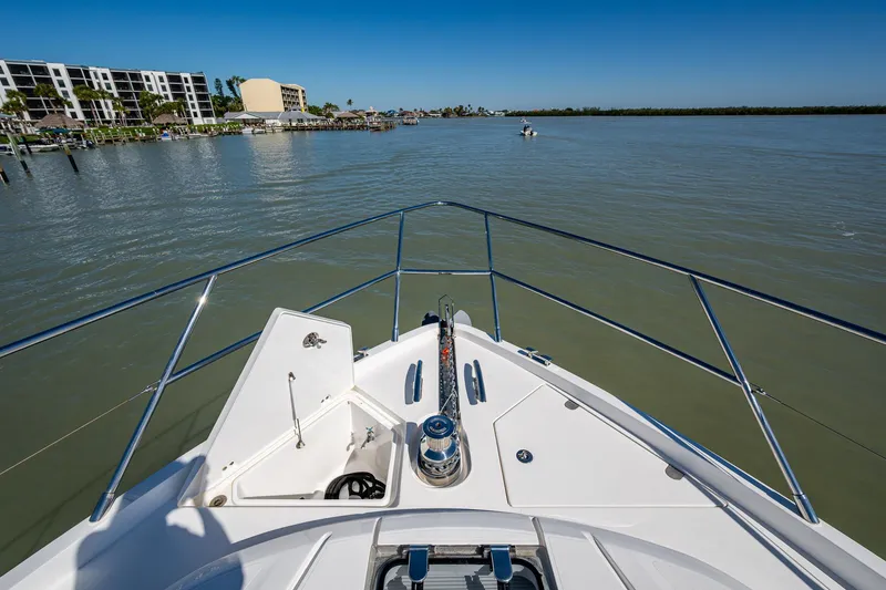 No Vacansea Yacht Photos Pics Bow view of 2016 Princess Flybridge 64 Motor Yacht on calm waters.