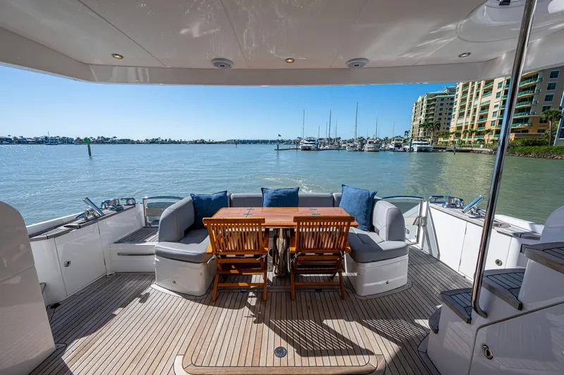 No Vacansea Yacht Photos Pics Luxurious 2016 Princess Flybridge 64 Motor Yacht deck with seating and scenic marina view.