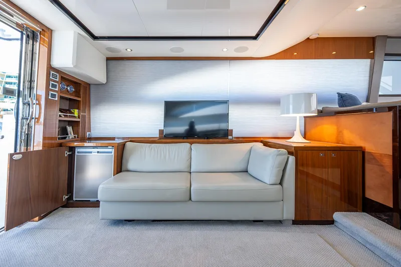 No Vacansea Yacht Photos Pics Luxurious interior of 2016 Princess Flybridge 64 Motor Yacht with sofa and TV.