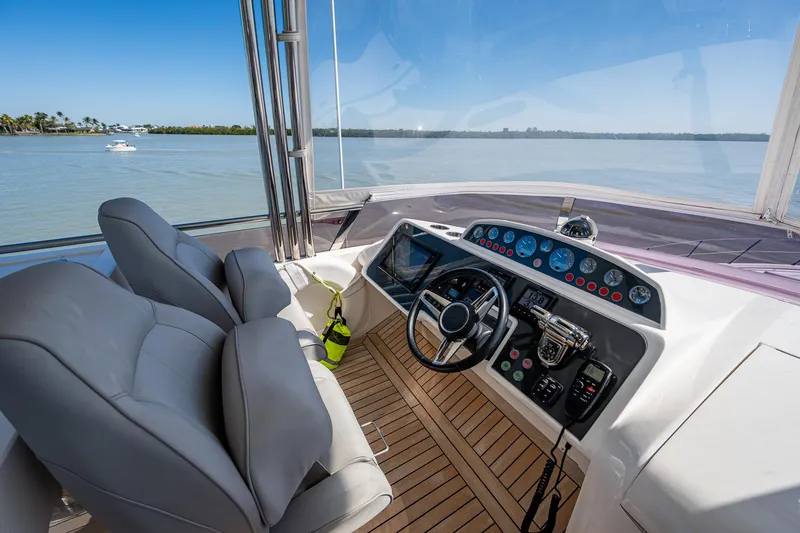 No Vacansea Yacht Photos Pics Flybridge helm of 2016 Princess Flybridge 64 Motor Yacht with scenic water view.