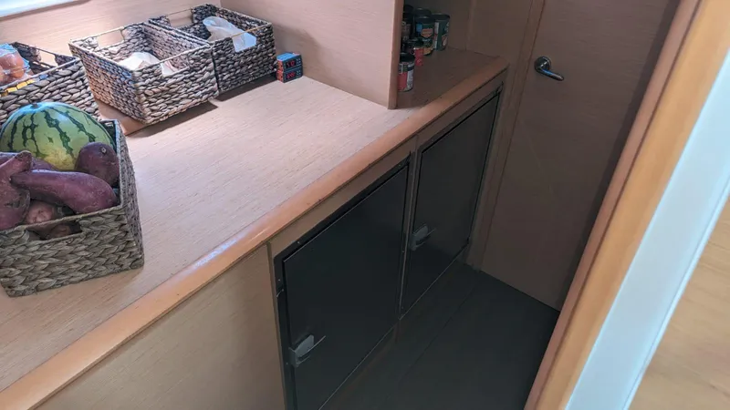 Sandstar Yacht Photos Pics Lagoon 500 yacht kitchen with storage baskets and cabinets, 2009 model.