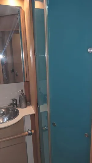 Sandstar Yacht Photos Pics Bathroom interior of 2009 Lagoon 500 yacht with sink and shower.