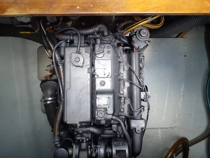 Sandstar Yacht Photos Pics Engine compartment of a 2009 Lagoon 500 catamaran, showcasing mechanical components.