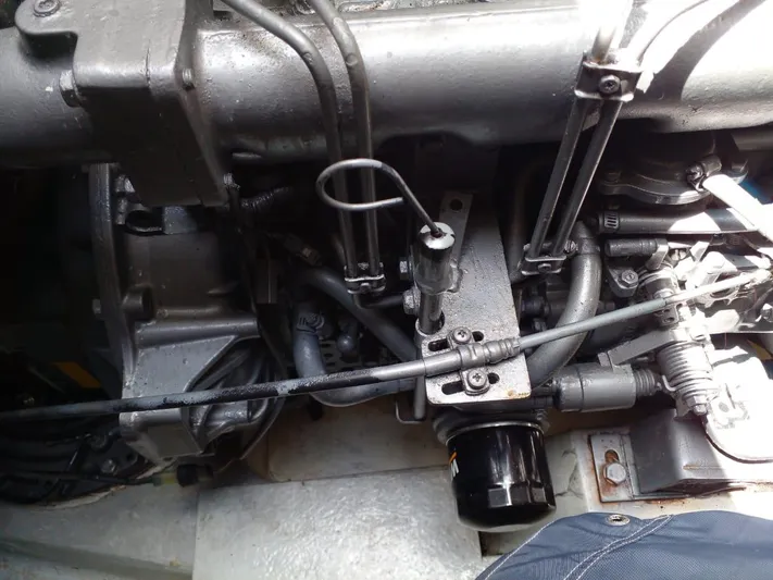 Sandstar Yacht Photos Pics Engine compartment of a 2009 Lagoon 500 catamaran, showcasing mechanical components and wiring.