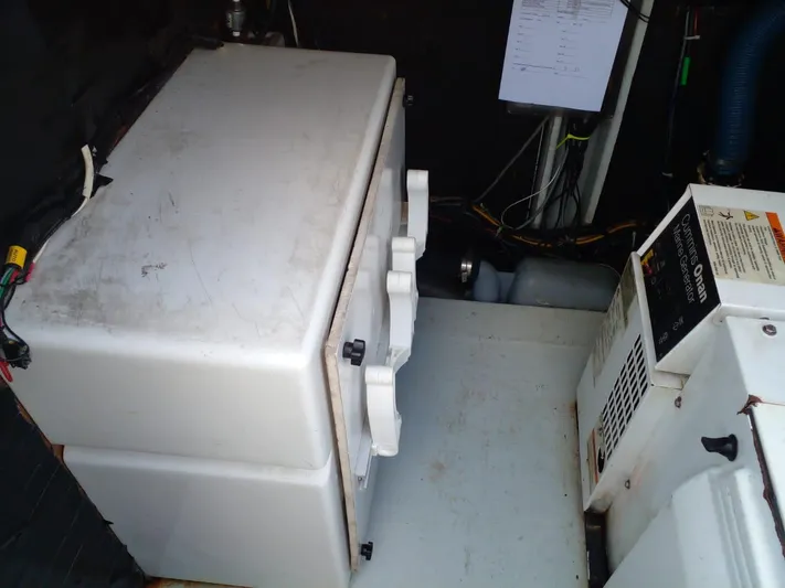 Sandstar Yacht Photos Pics Engine room of 2009 Lagoon 500 catamaran with equipment and wiring.