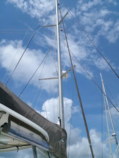 Sandstar Yacht Photos Pics Lagoon 500 sailboat mast against a blue sky with clouds, 2009 model.