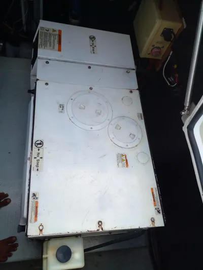 Sandstar Yacht Photos Pics 2009 Lagoon 500 engine compartment with visible access panels and control box.