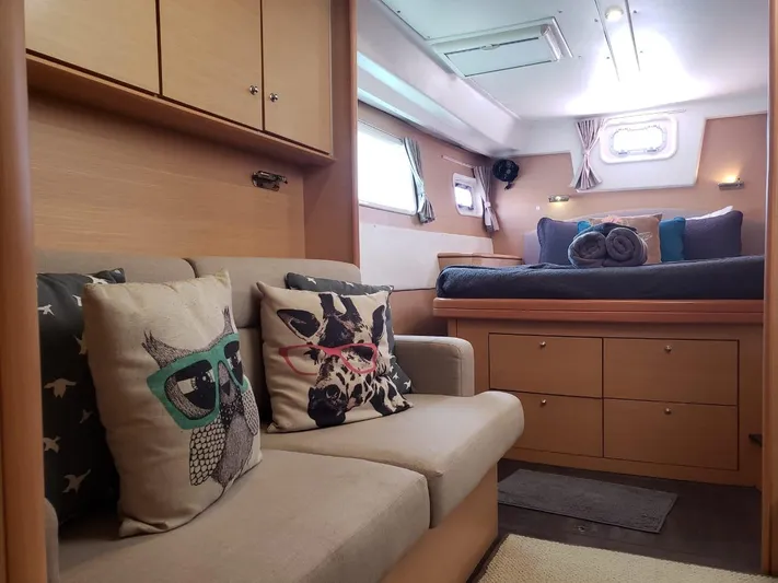 Sandstar Yacht Photos Pics Cozy interior of 2009 Lagoon 500 yacht with stylish cushions and comfortable bedding.
