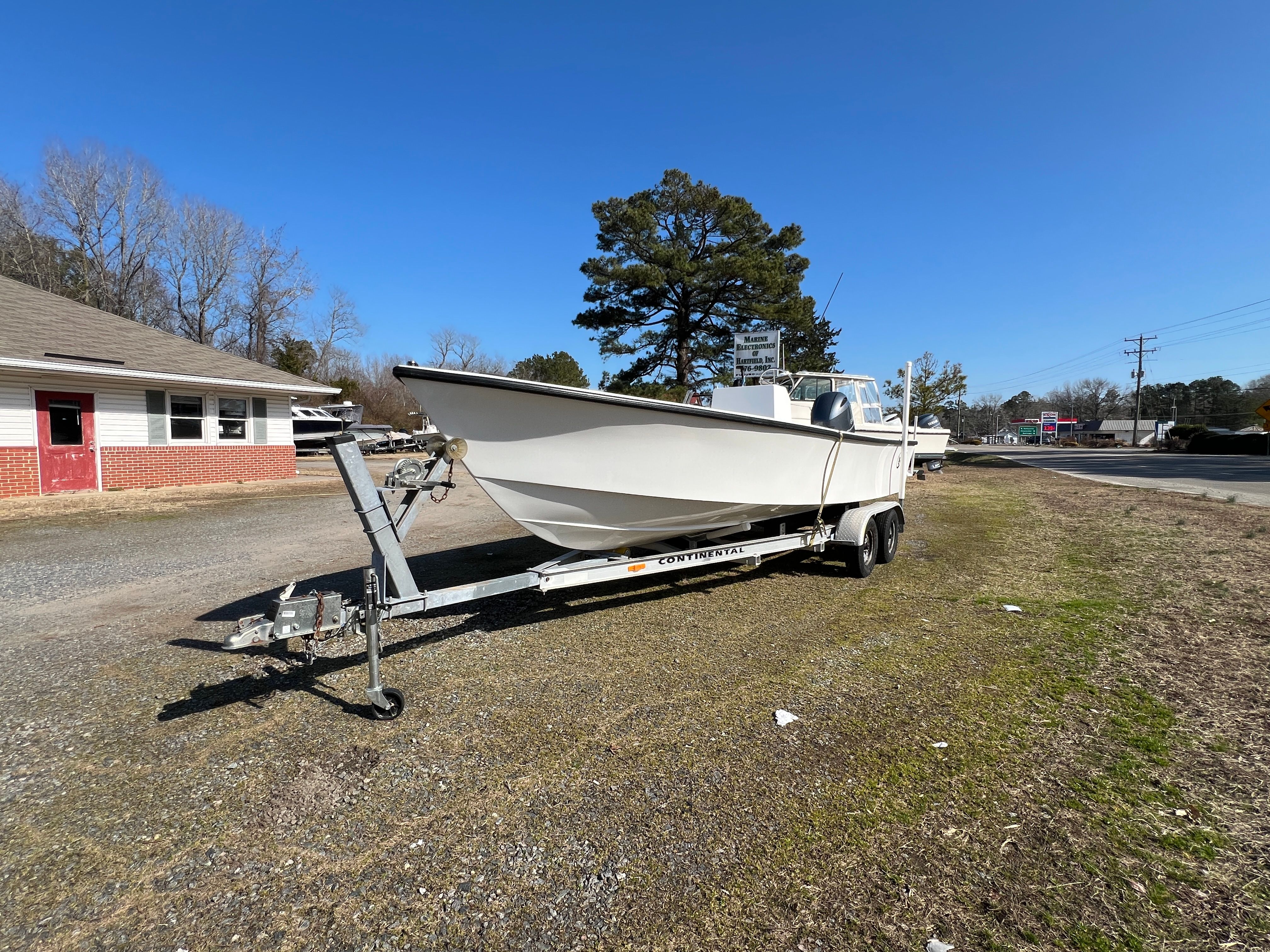 2025 C-Hawk 22 Center Console on trailer, sunny day.