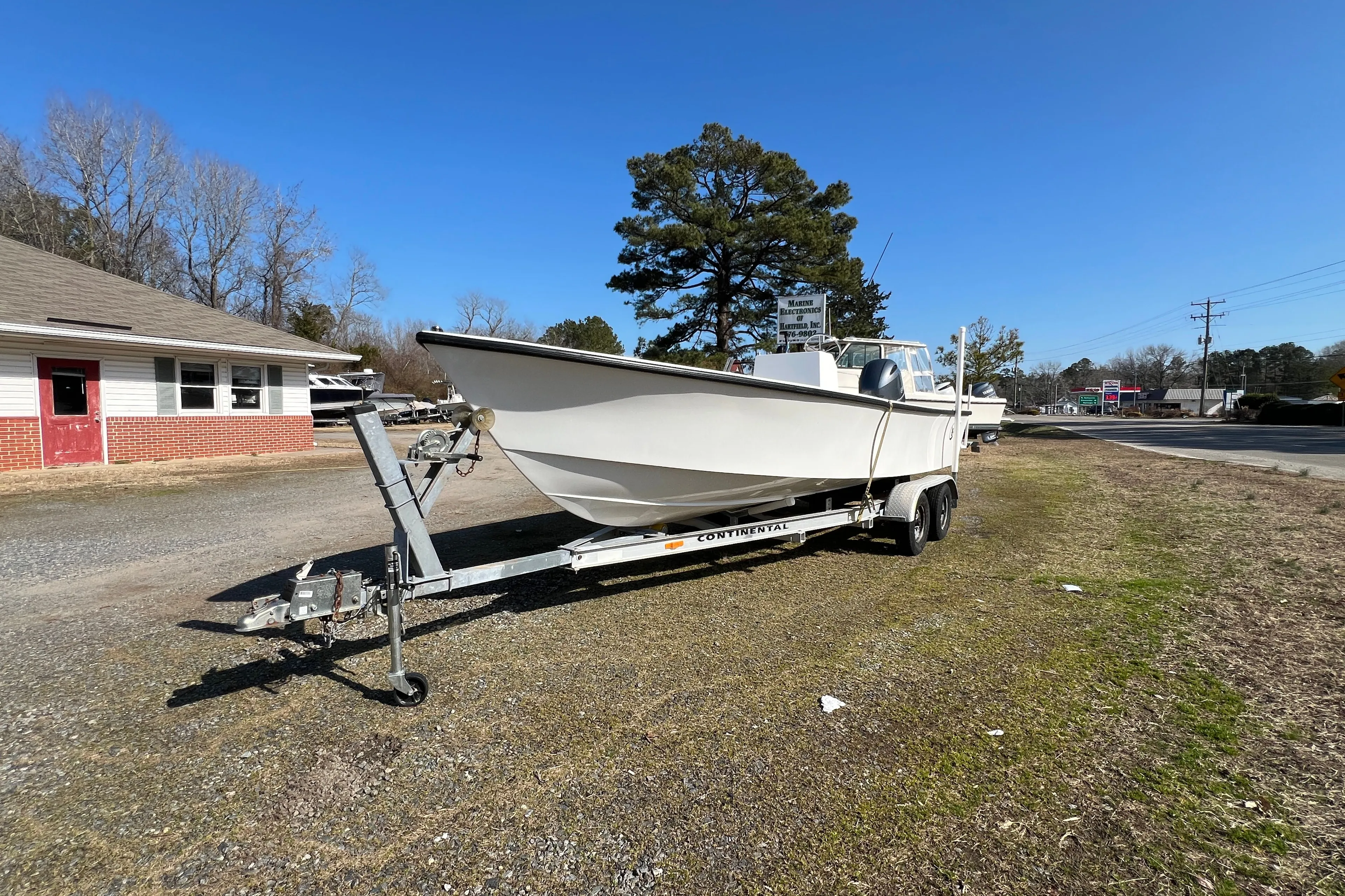 2025 C-Hawk 22 Center Console on trailer, sunny day.