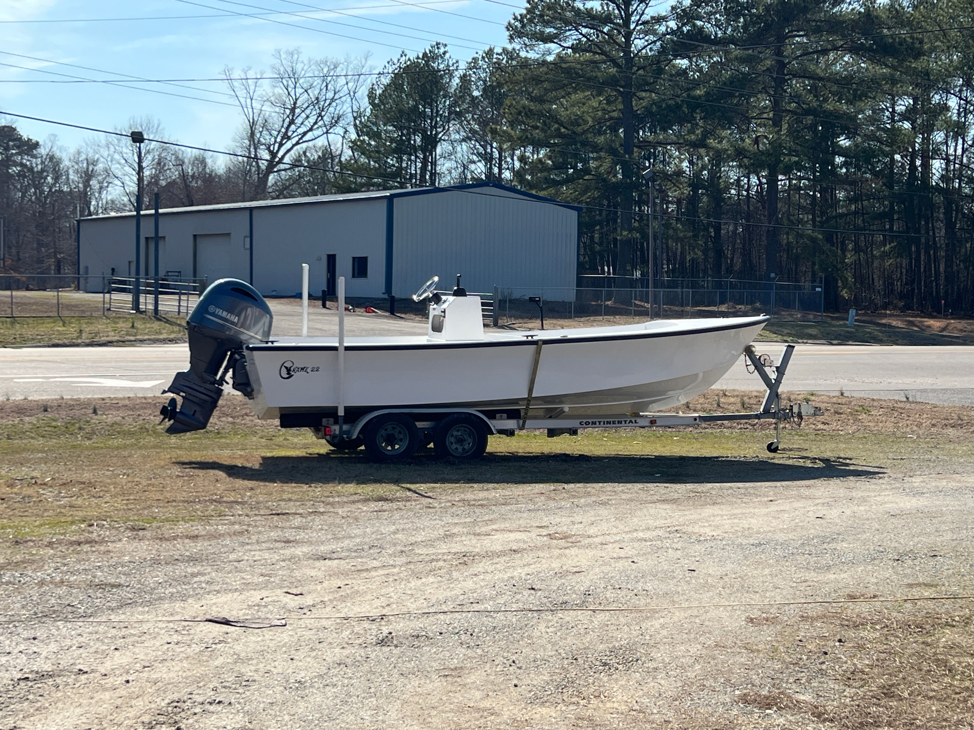 2025 C-Hawk 22 Center Console boat on trailer outdoors.