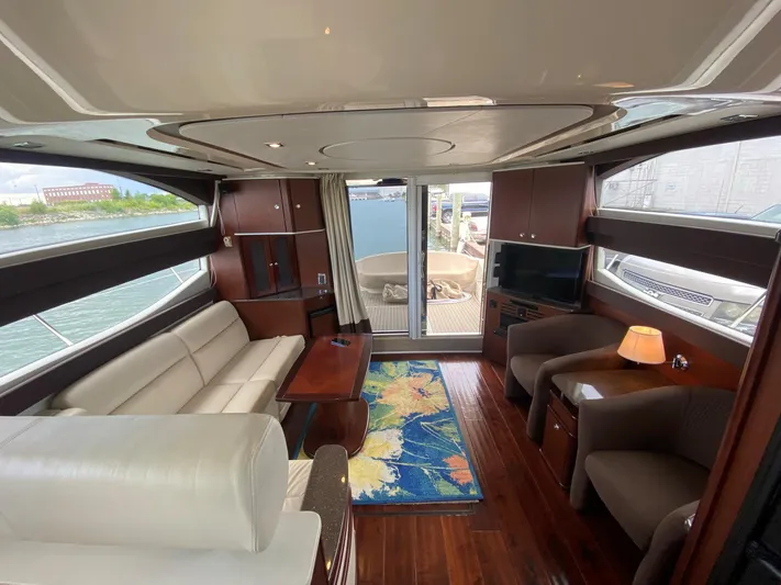 Lucid Dreams Yacht Photos Pics Luxurious interior of 2014 Meridian 441 Sedan yacht with elegant seating and modern amenities.