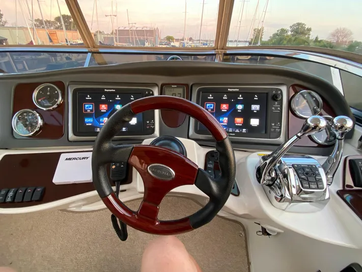 Lucid Dreams Yacht Photos Pics 2014 Meridian 441 Sedan helm with dual displays and polished controls.