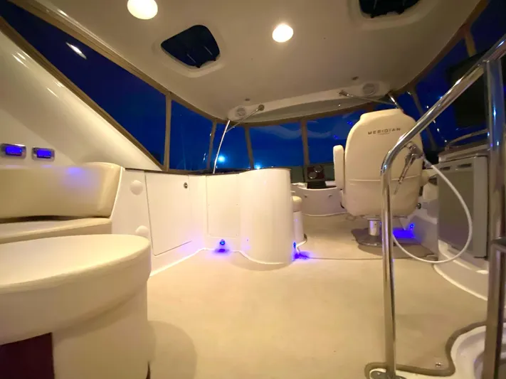 Lucid Dreams Yacht Photos Pics Luxurious interior of 2014 Meridian 441 Sedan yacht with modern seating and ambient lighting.