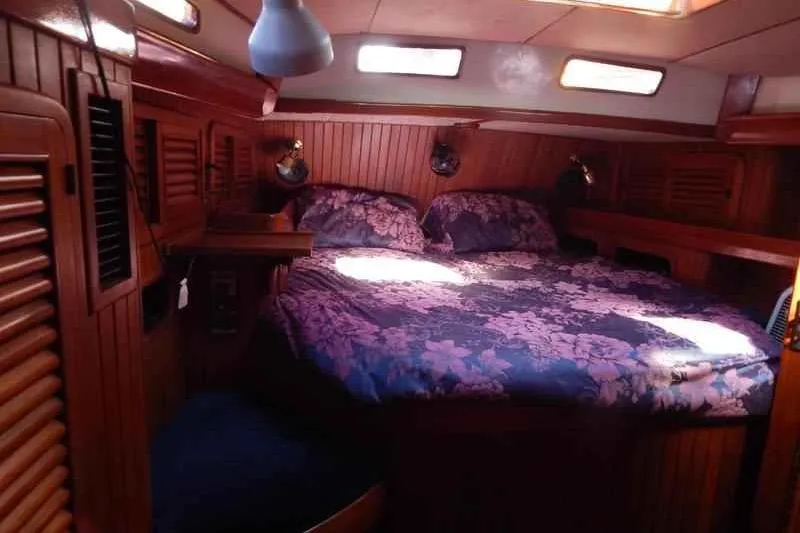 Sacred Space Yacht Photos Pics Cozy cabin interior of 1992 Hans Christian Christina sailboat with floral bedding.