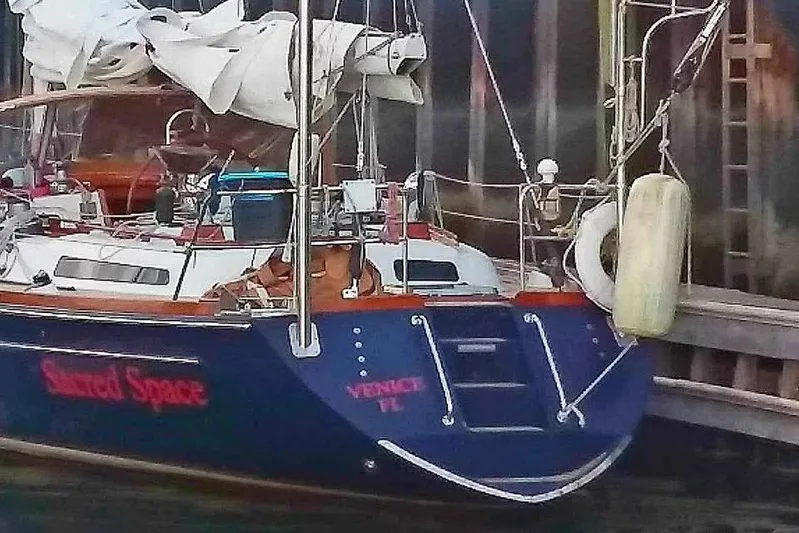 Sacred Space Yacht Photos Pics Sailboat "Shared Space" docked, Hans Christian Christina 1992 model, with folded sails.