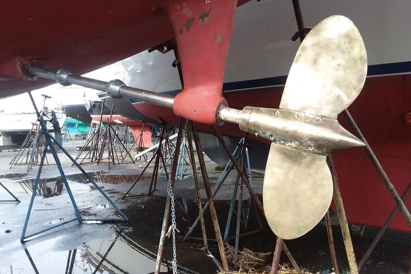 Sacred Space Yacht Photos Pics Propeller of 1992 Hans Christian Christina sailboat on stands in a boatyard.
