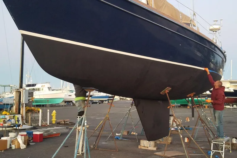 Sacred Space Yacht Photos Pics 1992 Hans Christian Christina sailboat undergoing maintenance in a boatyard.