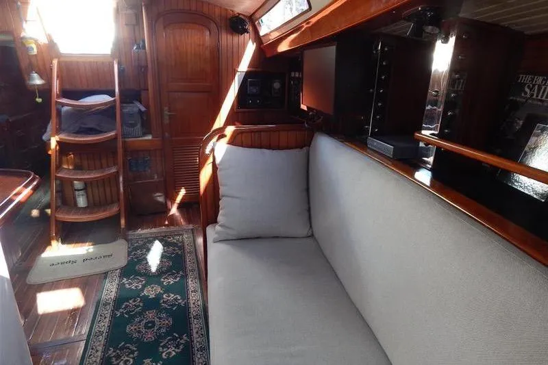 Sacred Space Yacht Photos Pics Interior of 1992 Hans Christian Christina yacht with wooden finish and cozy seating.