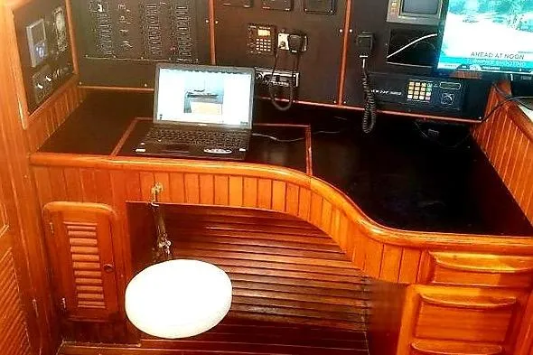 Sacred Space Yacht Photos Pics Navigation station on 1992 Hans Christian Christina yacht with laptop and control panels.