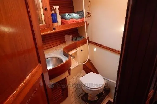 Sacred Space Yacht Photos Pics 1992 Hans Christian Christina yacht bathroom with wooden cabinetry and compact design.