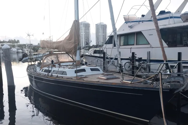 Sacred Space Yacht Photos Pics Sailboat docked at marina, Hans Christian Christina 1992 model, with cityscape background.