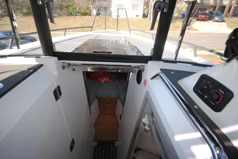  Yacht Photos Pics 2015 XO Boats 270 RS interior view, showcasing cabin entrance and deck layout.