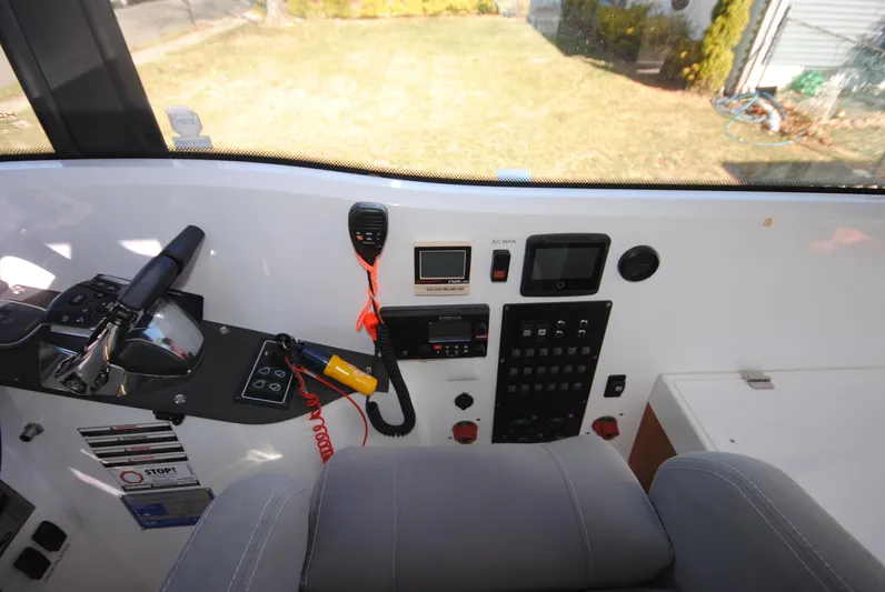  Yacht Photos Pics Interior cockpit of 2015 XO Boats 270 RS with control panel and navigation equipment.