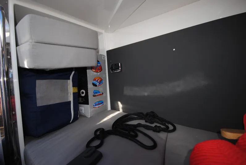  Yacht Photos Pics Interior cabin of 2015 XO Boats 270 RS with storage and cushions.