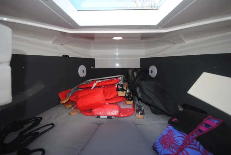  Yacht Photos Pics Interior cabin of 2015 XO Boats 270 RS with life jackets and gear.